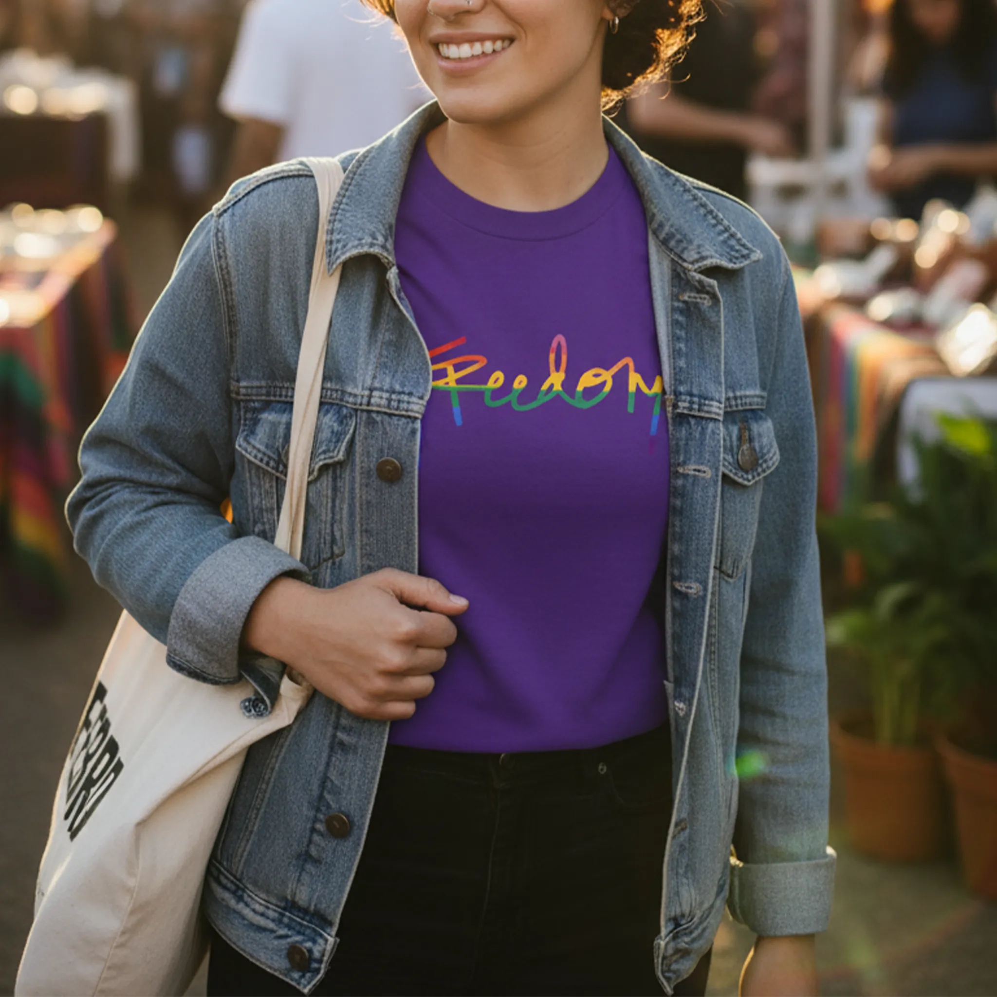 Freedom! Rainbow Script Premium T-Shirt, purple, layered denim jacket, outdoor weekend market,  lifestyle.
