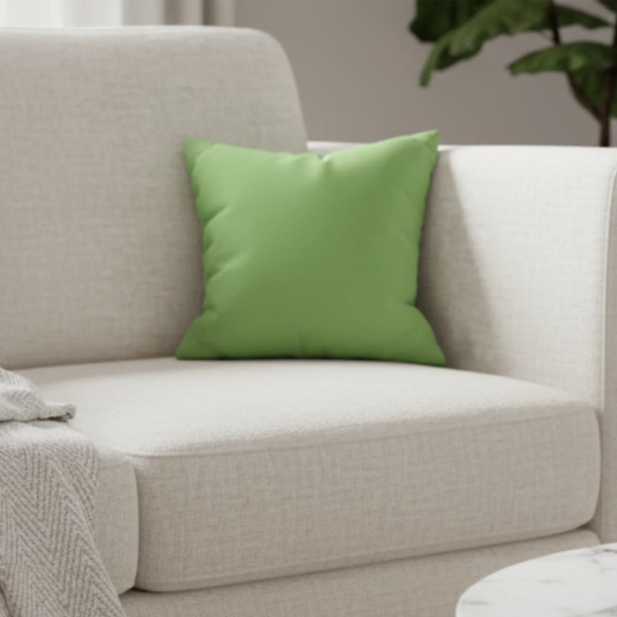 Fresh green faux suede pillow case styled on a couch in modern living room. 