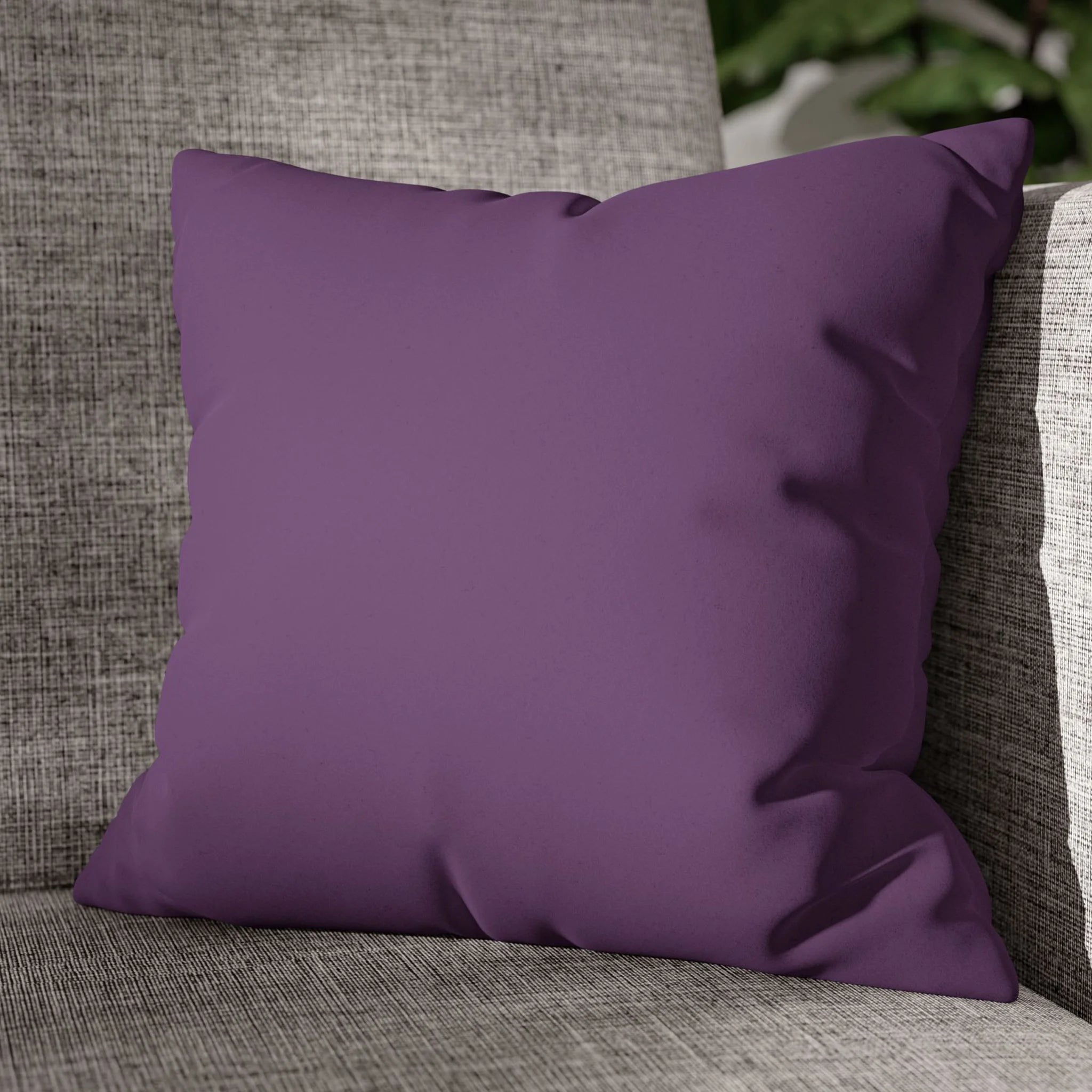 Garlic Purple faux suede pillow case styled on a couch in a modern living room.