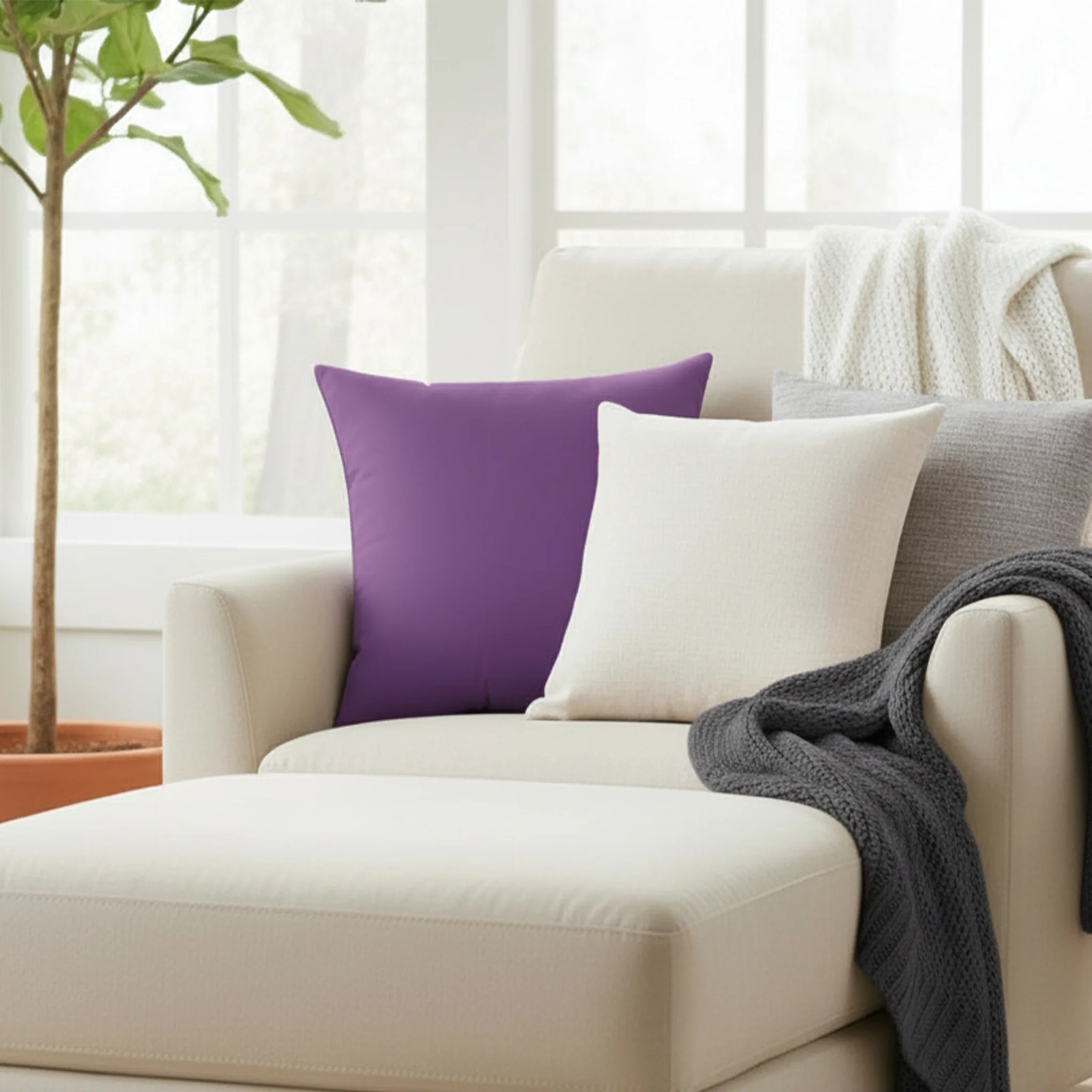 Garlic purple faux suede pillow styled on sofa chair with accent pillows, rich plum purple home decor.