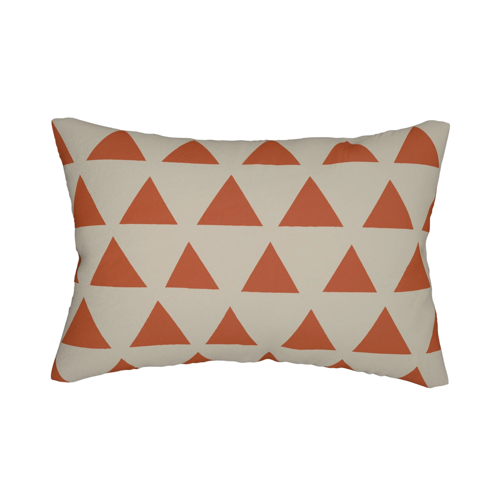 Geometric terracotta triangle lumbar pillow, back view.