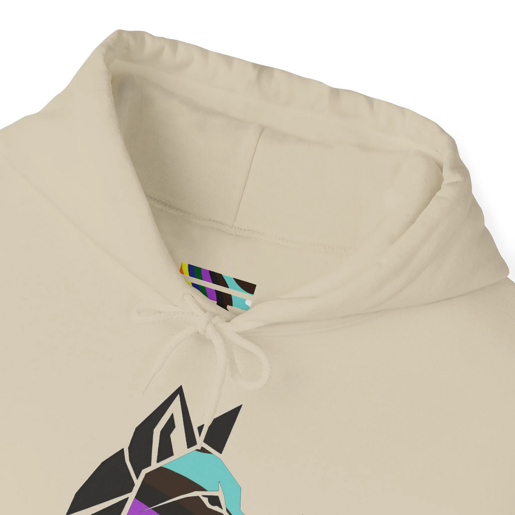 Close-up of a sand-colored hoodie neckline showing a multicolored FREEBRD LGBTQIA Pride inner-neck logo, matching drawstrings and part of the geometric wolf graphic.