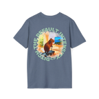 A heather indigo t-shirt featuring a capybara on a treadmill graphic with sea green Ditch The Default Intensity circular text on the back.