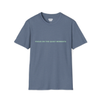 A  heather indigo t-shirt with sea green Focus On The Quiet Moments text on the chest.