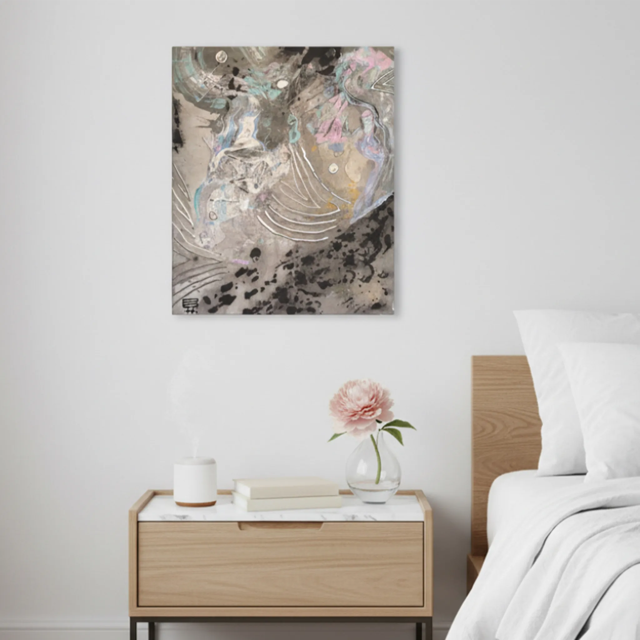 “Ink Cloud” Abstract Canvas Wall Art hanging on a wall in a modern bedroom above a nightstand. 