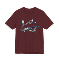 Live Free Afrostar Script Premium Tee, maroon, front view, fluid pour graphic.