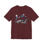 Live Free Afrostar Script Premium Tee, maroon, front view, fluid pour graphic.