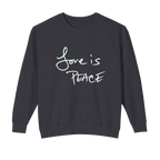 Black crewneck pullover with light-colored Love is Peace lettering across the chest, front view.