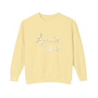 Pale yellow crewneck pullover with white Love is Peace lettering and a dark offset shadow, front view.