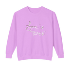 Violet crewneck pullover with white Love is Peace lettering and a dark offset shadow, front view.