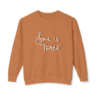 Burnt orange crewneck pullover with white Love is Peace lettering and a dark offset shadow, front view.