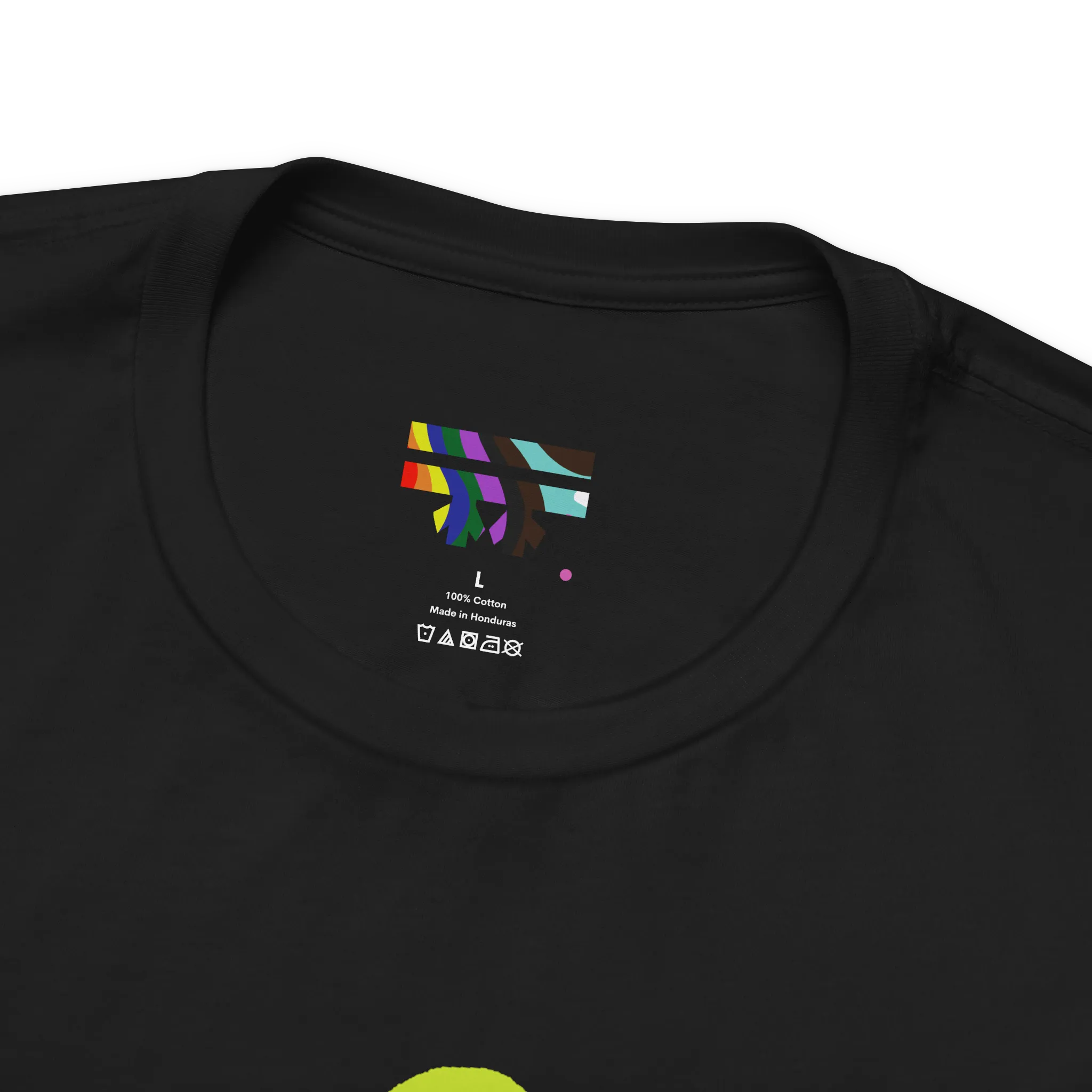 Love More Rainbow Heart Pride Tee, black, FREEBRD rainbow logo collar detail, close-up view.