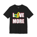 Love More Rainbow Heart Pride Tee, black, bold LOVE MORE graphic with rainbow heart, front view.