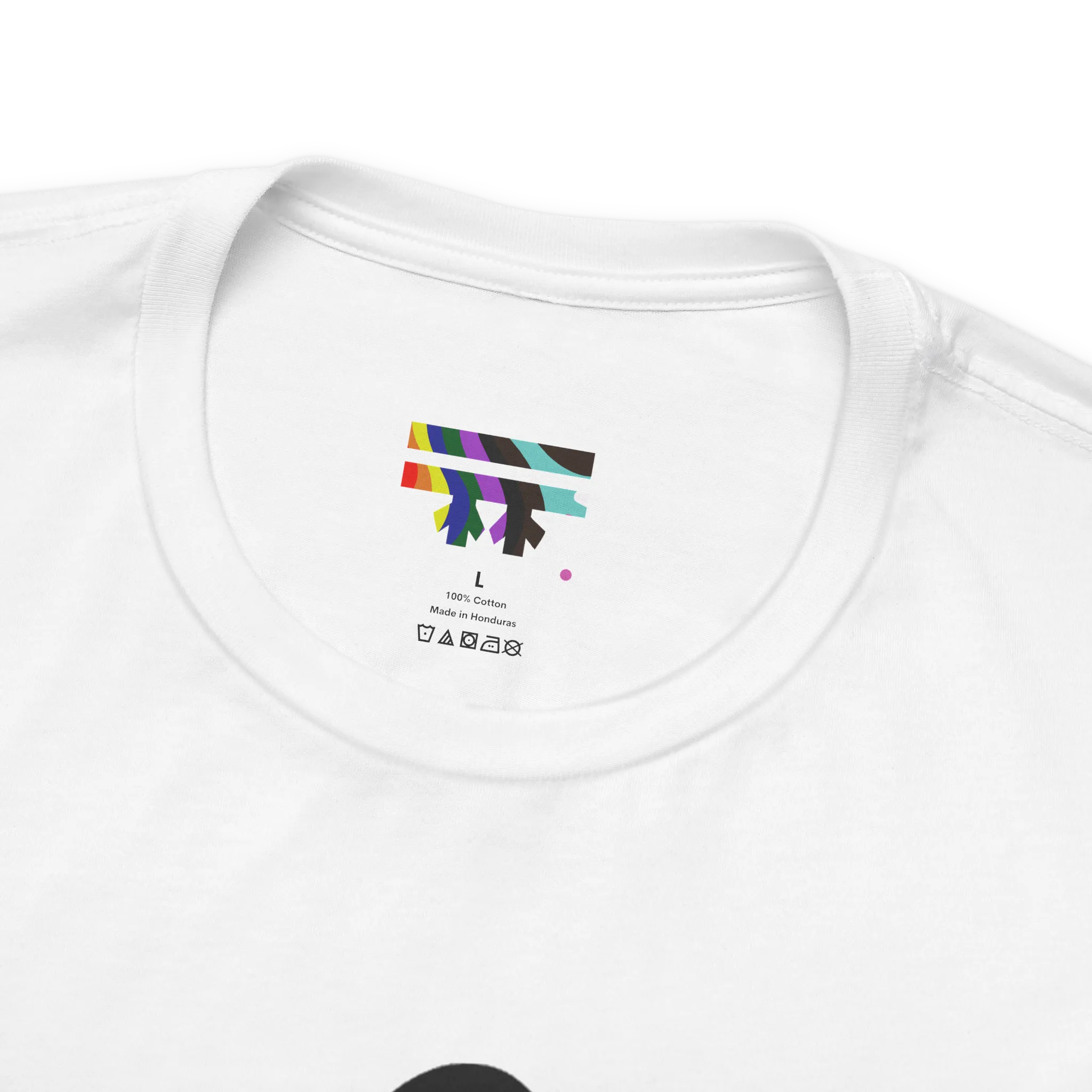 Love More Rainbow Heart Pride Tee, white, FREEBRD rainbow logo collar detail, close-up view.