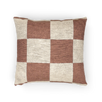 A horizontal view of the Mimosa Pink Woven Checker Pillow, showing a mimosa pink checker pattern on an oatmeal cream colored background. 