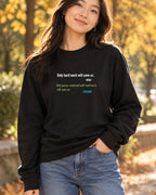 Black long sleeve tee with motivational quote graphic, lifestyle photo of a woman in jeans outdoors in a fall setting.