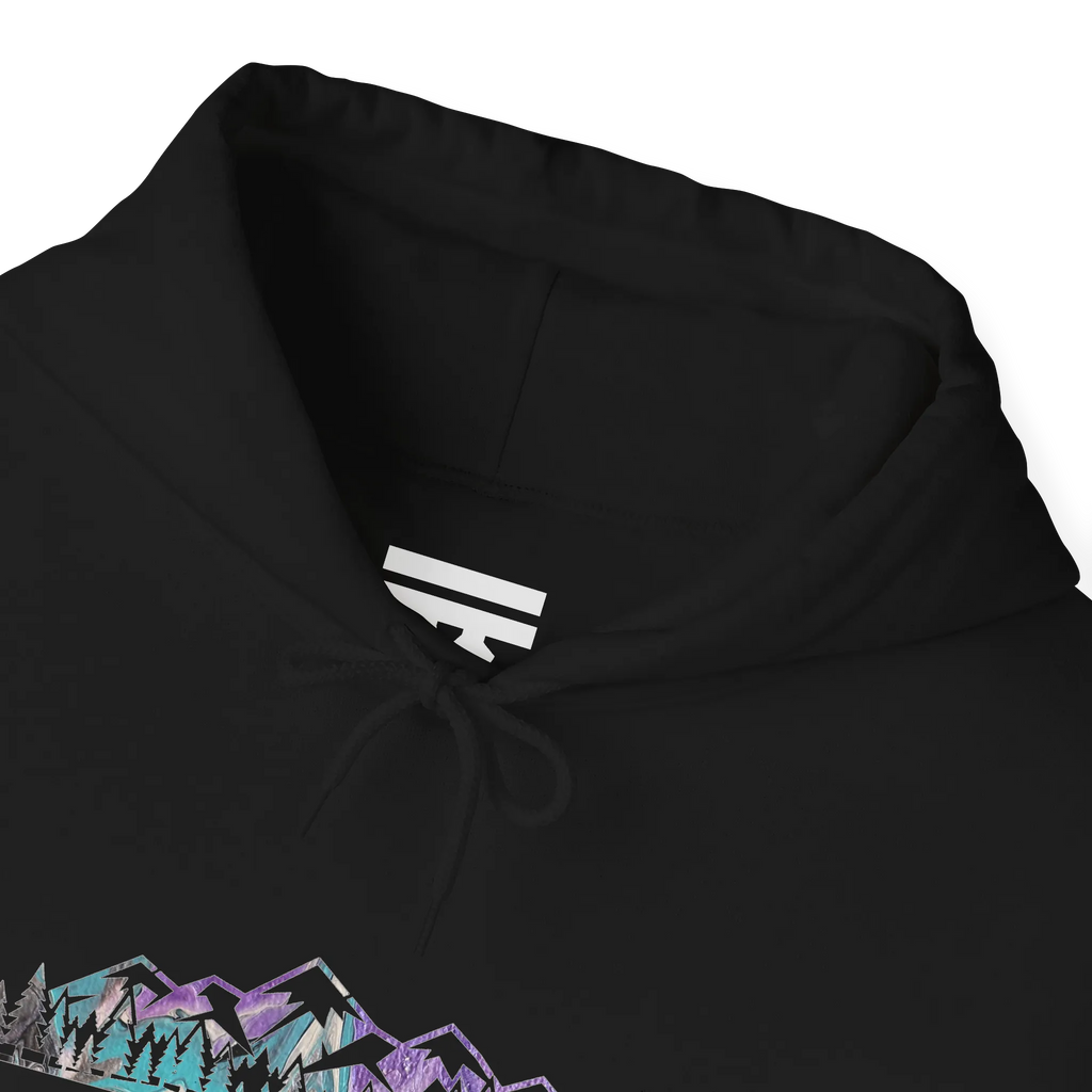 Close-up of a black hoodie neckline showing a white inner-neck logo, black drawstrings and part of the mountain graphic.