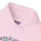 Close-up of a light pink hoodie neckline showing a purple inner-neck logo, pink drawstrings and part of the mountain graphic.
