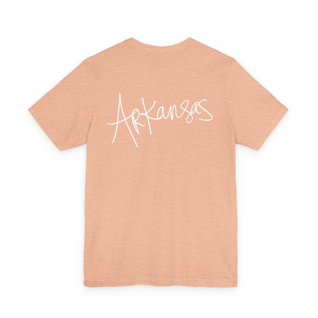 Natural Arkansas tee, heather peach, bold white handwritten Arkansas script, back view.