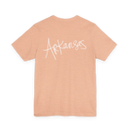 Natural Arkansas tee, heather peach, bold white handwritten Arkansas script, back view.