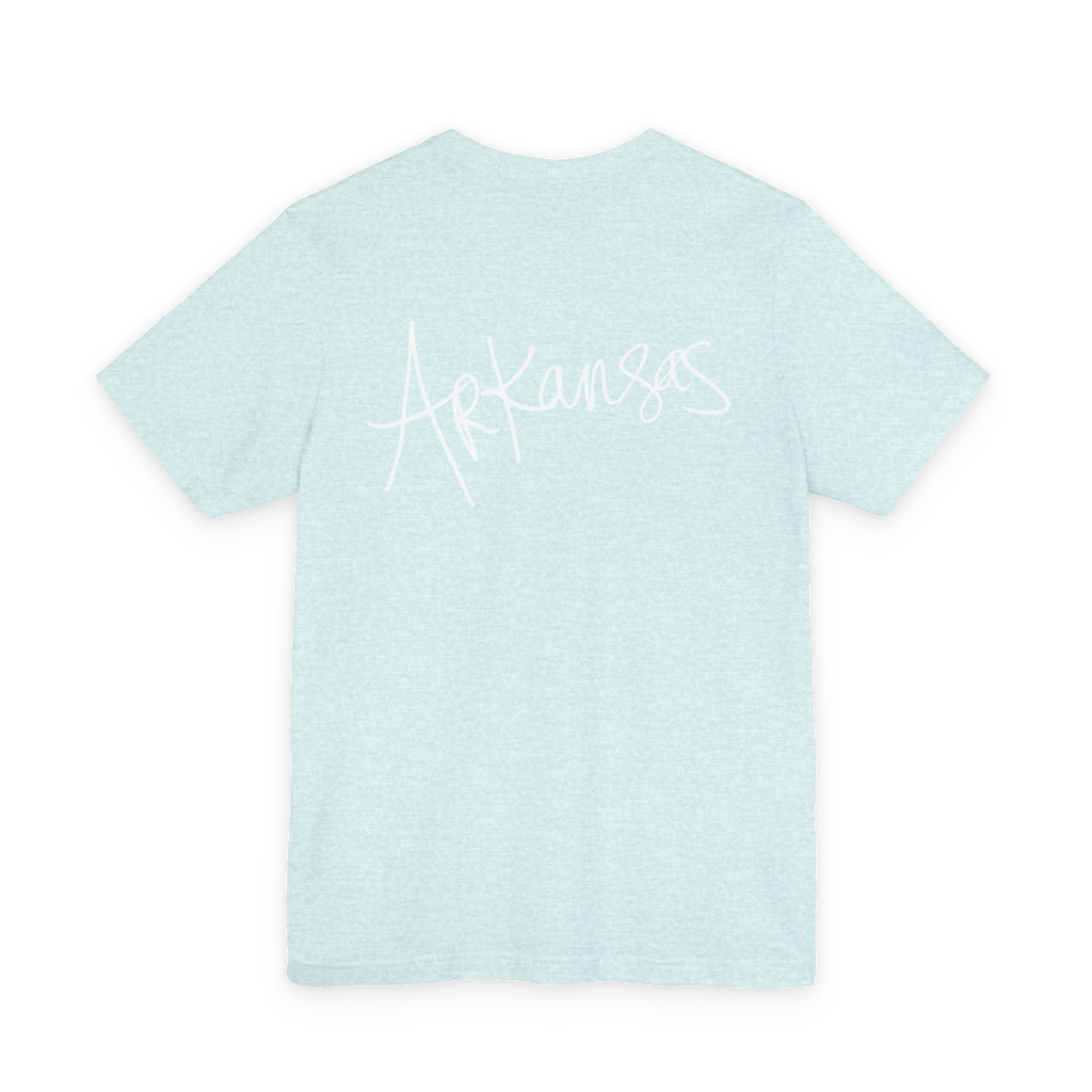 Natural Arkansas tee, heather prism ice blue, bold white handwritten Arkansas script, back view.