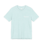 Natural script tee, heather prism ice blue, front chest bold white text that says, “Natural.”