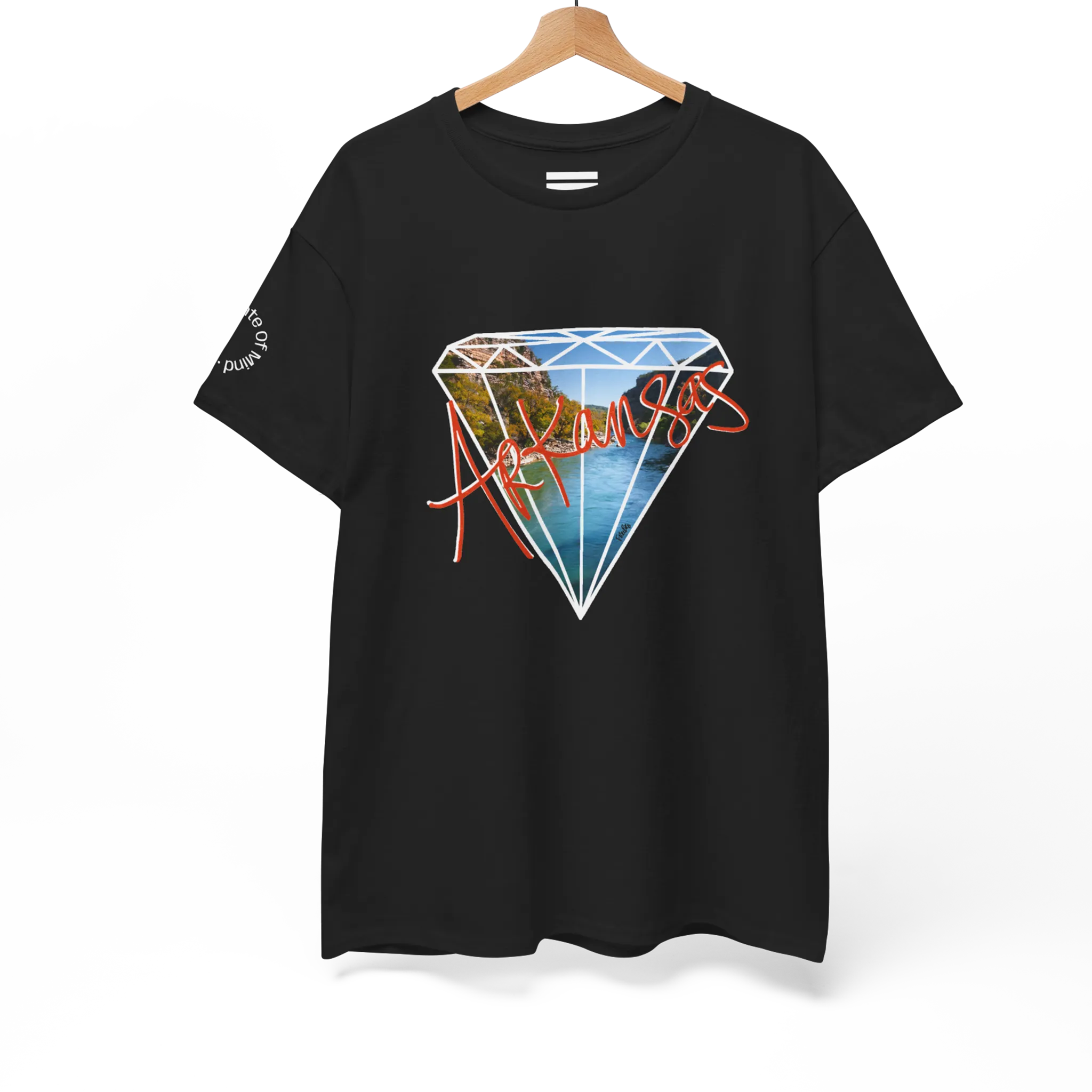A black FREEBRD Natural State of Mind t-shirt on a hanger displaying the white diamond graphic with Arkansas river photo fill and red 'Arkansas’ script.