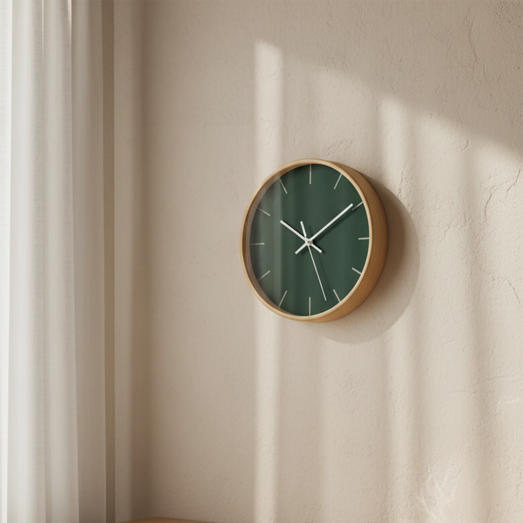 Stromboli Green Wall Clock hanging in  a cozy home office — natural wood frame.