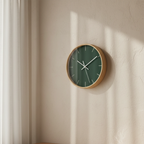 Stromboli Green Wall Clock hanging in  a cozy home office — natural wood frame.