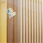 No Kings rainbow kiss-cut vinyl sticker on glass window, lifestyle display, FREEBRD Pride Gear.