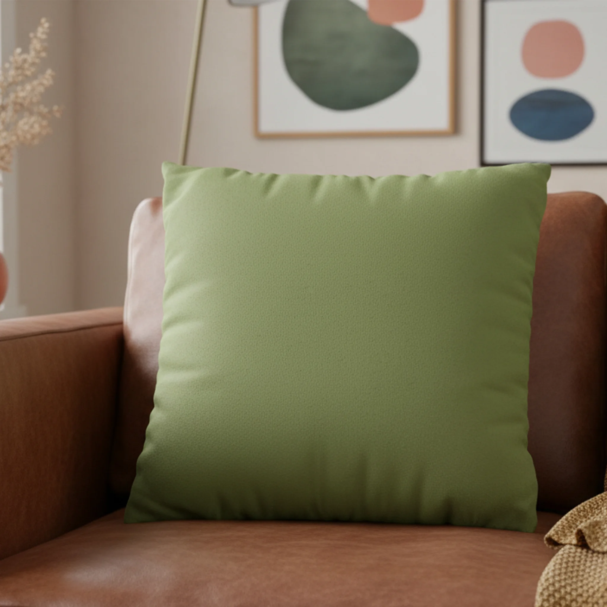 Olive Green faux suede pillowcase styled on a sofa chair in a modern living room. 