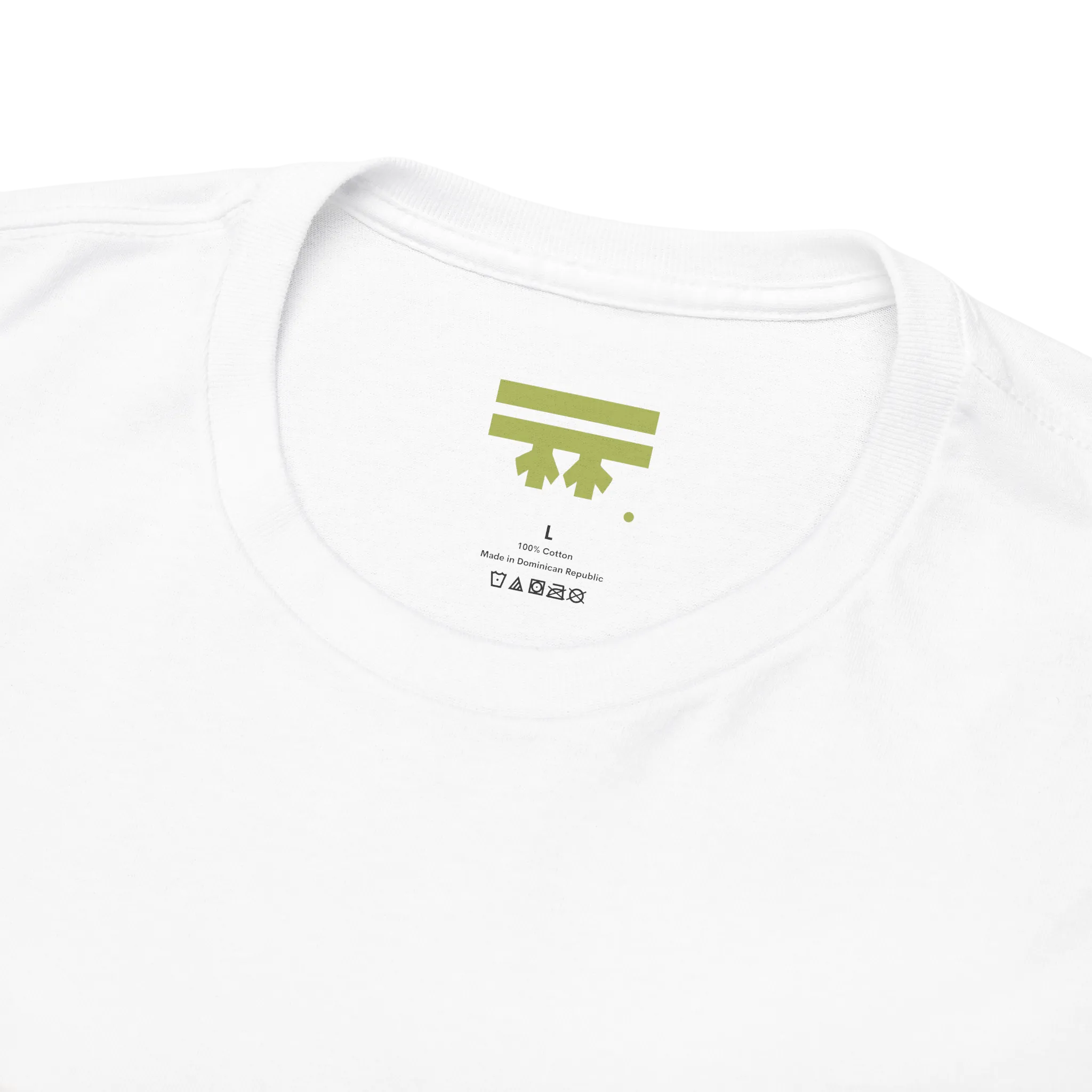 White graphic tee collar detail showing FREEBRD branded inner label, size and care info visible.