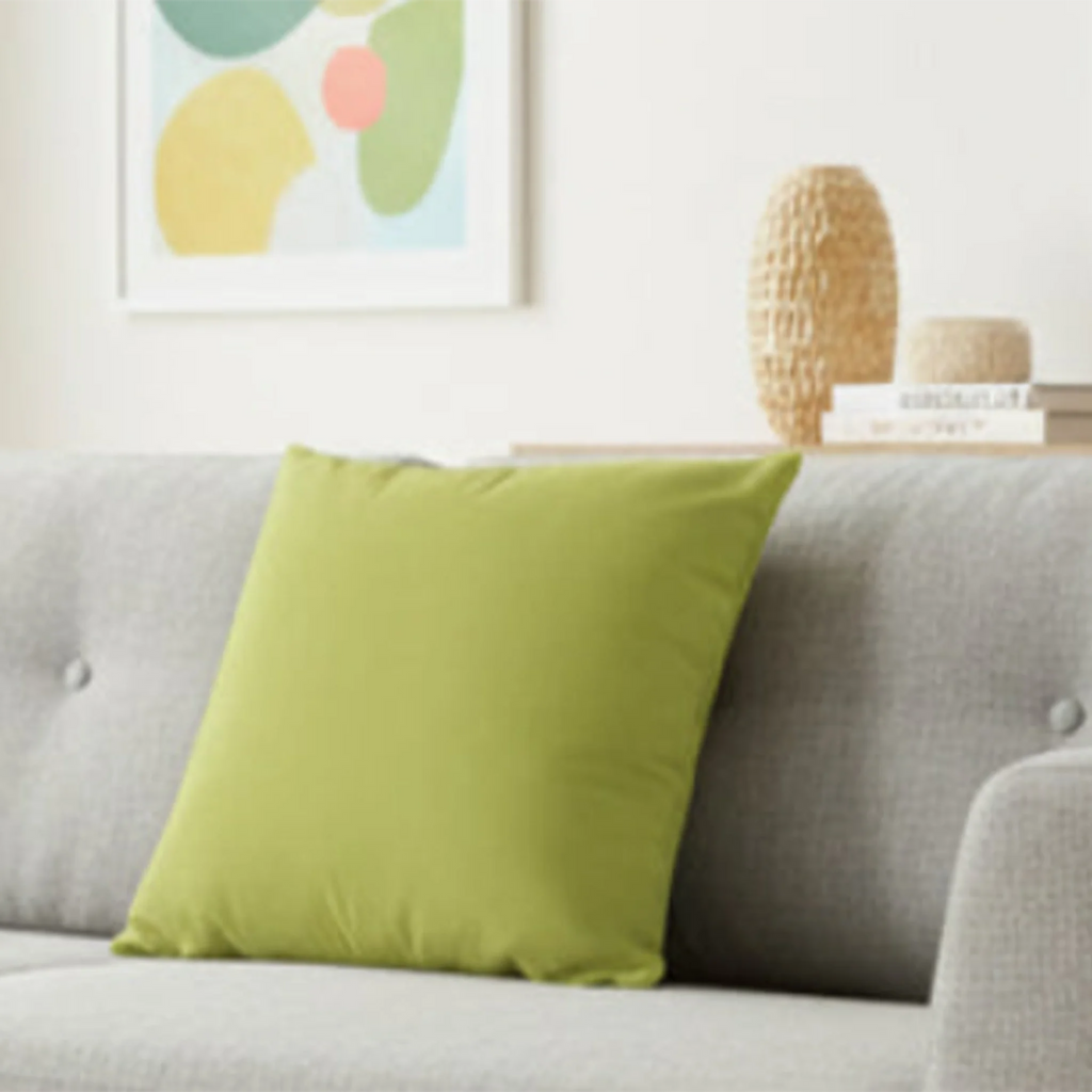 Orchid Green faux suede pillow case styled on a couch in a modern living room?