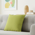 Orchid Green faux suede pillow case styled on a couch in a modern living room?