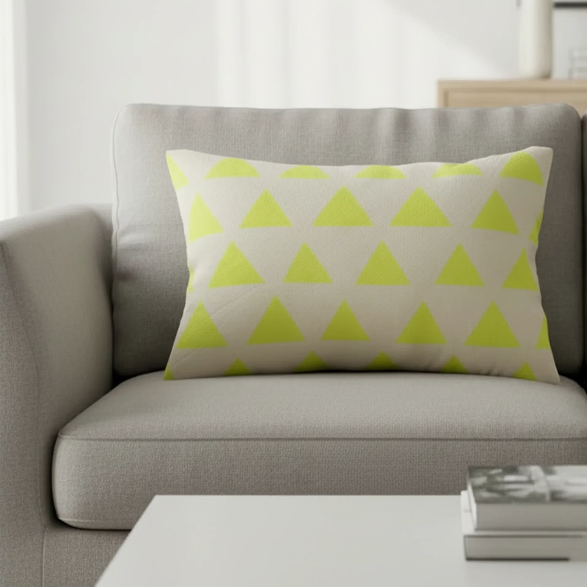 Orchid lime geometric triangle lumbar pillow styled on a couch in a modern living room.