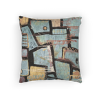 A back view of the ‘Patchy’ decorative woven accent pillow with an urban abstract design that shows black and gold geometric lines.