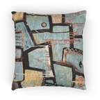 A front view of the ‘Patchy’ decorative woven accent pillow with an urban abstract design that shows black and gold geometric lines.