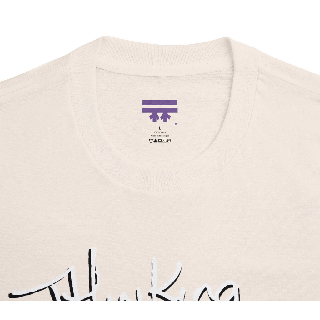 Classic fit crew neck tee, cream, collar close-up showing brand label, 100% cotton.
