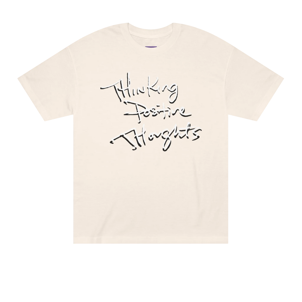 Classic fit crew neck tee, cream, front view, handwritten script graphic reading Thinking Positive Thoughts in black with white outline.