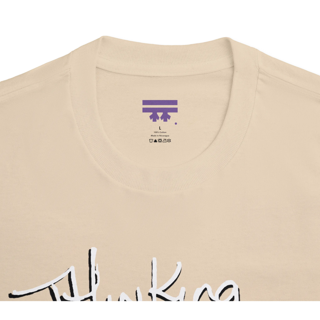Classic fit crew neck tee, sand, collar close-up showing brand label, 100% cotton.
