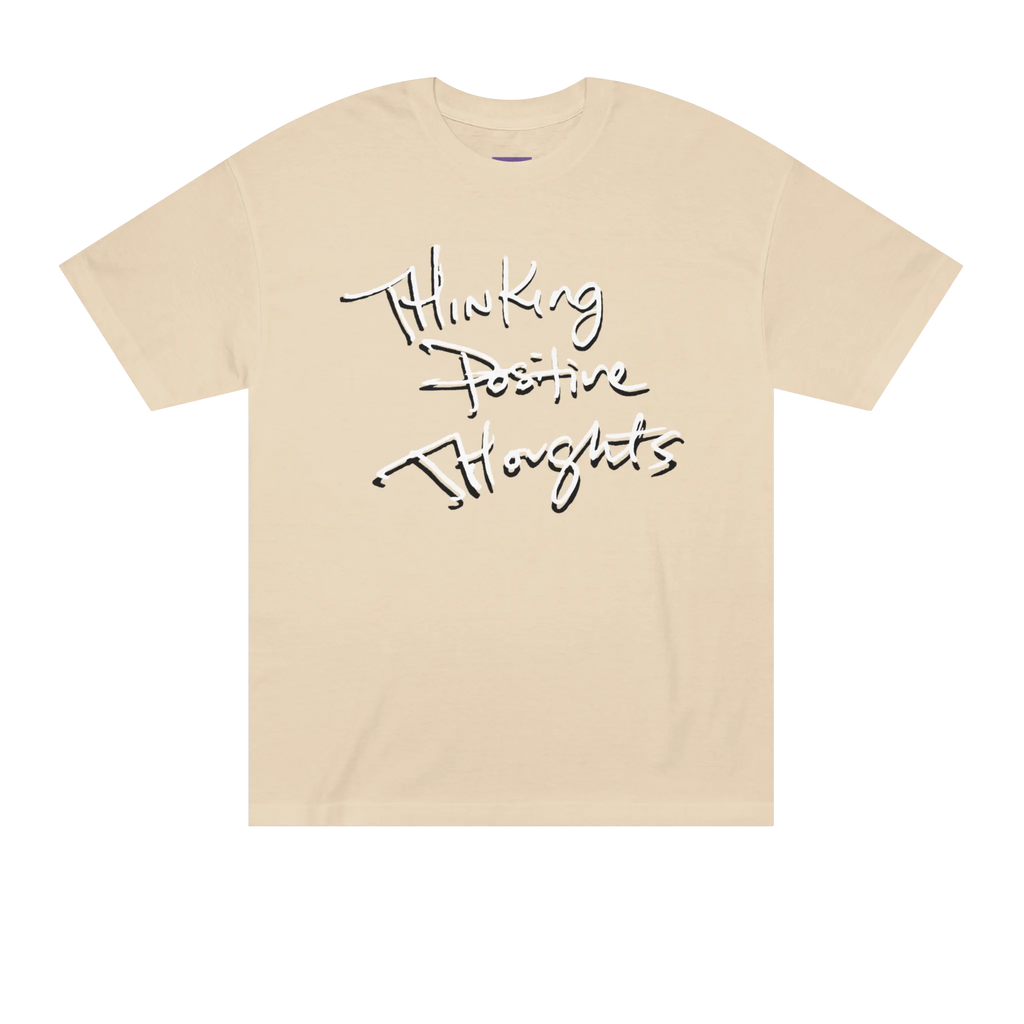 Classic fit crew neck tee, sand, front view, handwritten script graphic reading Thinking Positive Thoughts in black with white outline.