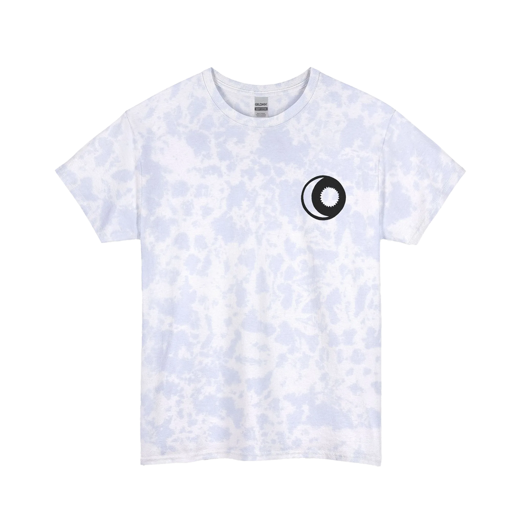 A powder cloud spiral tie-dye t-shirt with a faint purple and blue speckle pattern with white dye veins, featuring a sun and moon graphic on the front.
