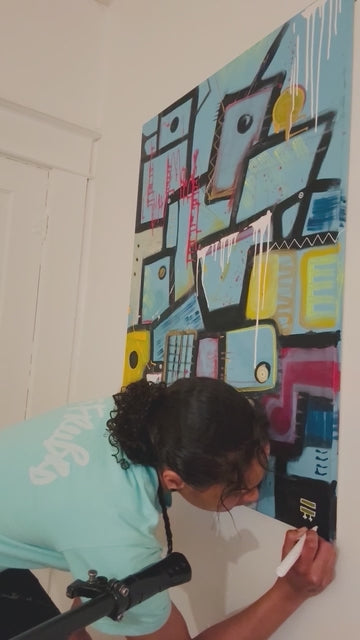 local artist Jasmine Jackson signing her FREEBRD signature on her urban abstract artwork piece, ‘Patchy’ live. 