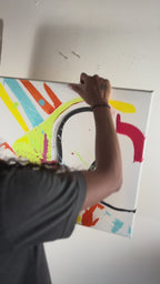 Artist hanging Stripe Status, an abstract acrylic painting with sweeping black curves and colorful marks on a white ground, on a wall.