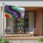 The Pride Rainbow Wave Flag flying on a pole outside a modern home patio, displaying vibrant abstract rainbow wave colors.