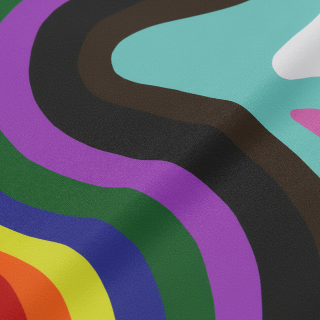 A close-up of the Pride Rainbow Wave Flag fabric showing the fine polyester weave and vibrant abstract rainbow wave print quality.
