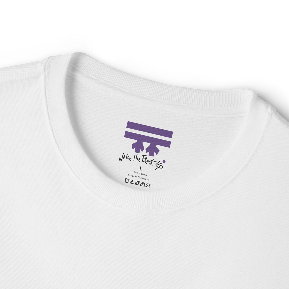 White T-shirt inner neck print with a purple FREEBRD logo and black handwritten text reading 'wake the flock up'.
