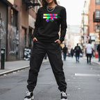 Freebrd Retro Glitch black crewneck with neon abstract graphic worn by a woman in black cargo pants on a NYC street.