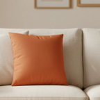 Roman Earth faux suede pillow case styled on a couch in a modern living room.