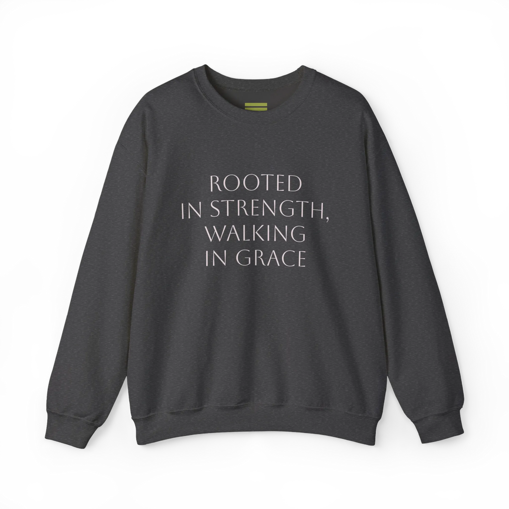 Dark grey heather crewneck sweatshirt with light-colored 'Rooted in strength, walking in grace' lettering across the chest, front flat lay.